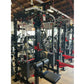 Black and red steel cable crossover power rack system with dual weight stacks, lat pulldown attachment, and adjustable pulley