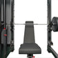 Black power rack with cable crossover system, lat pulldown machine, and weight plates, viewed from front with loaded barbell 