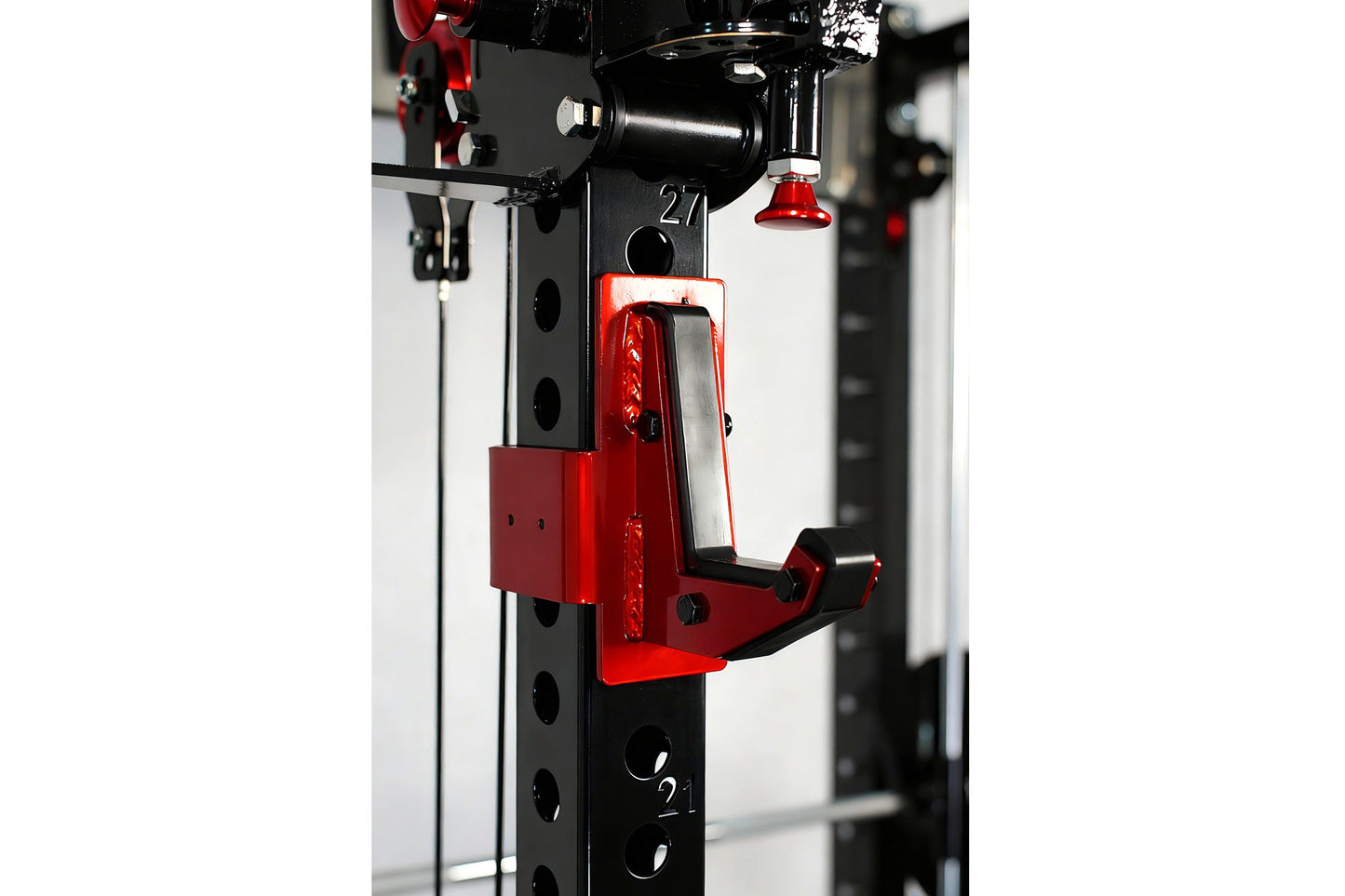 Red and black cable crossover pulley attachment mounted on black power rack frame with numbered markers, featuring dual pulle