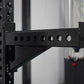 Black steel cable crossover arm with eight circular pulleys attached to vertical rack frame with angled support bracket