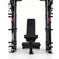 Black and red cable crossover power rack with dual weight stacks, lat pulldown station, and adjustable black weight bench pos