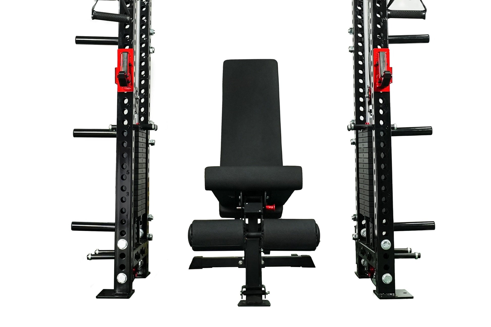 Black and red cable crossover power rack gym system with adjustable pulley arms, weight plates, and padded bench seat on whit