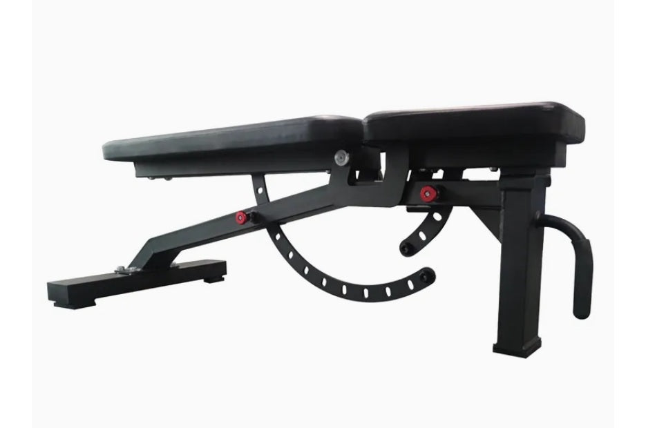 Black adjustable weight bench with padded seat and backrest, red adjustment handles, and leg extension attachment on white ba