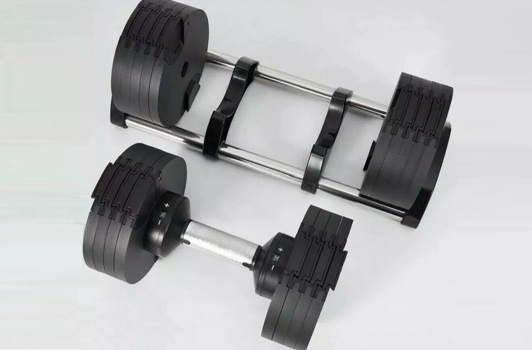 Black adjustable dumbbells with textured grip plates and chrome handles, shown as pair on white background