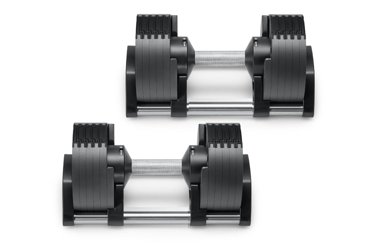 Pair of black and silver adjustable dumbbells with grooved weight plates and chrome handles, displayed on white background