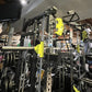 Warrior 701 all-in-one power rack with black and neon yellow functional trainer and cable crossover equipment in gym setting