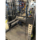 Warrior 701 black power rack with Smith machine cage, cable crossover, and dumbbell rack in gym setting