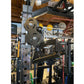 Warrior 701 all-in-one power rack with functional trainer cables, pulley system, and weight plates in workshop setting