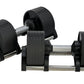 Pair of black adjustable dumbbells with metal handles and weight plates, shown in flat lay on white background