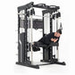 Man in black shirt using black and white multi-station home gym machine with cable pulleys and smith bar on white background