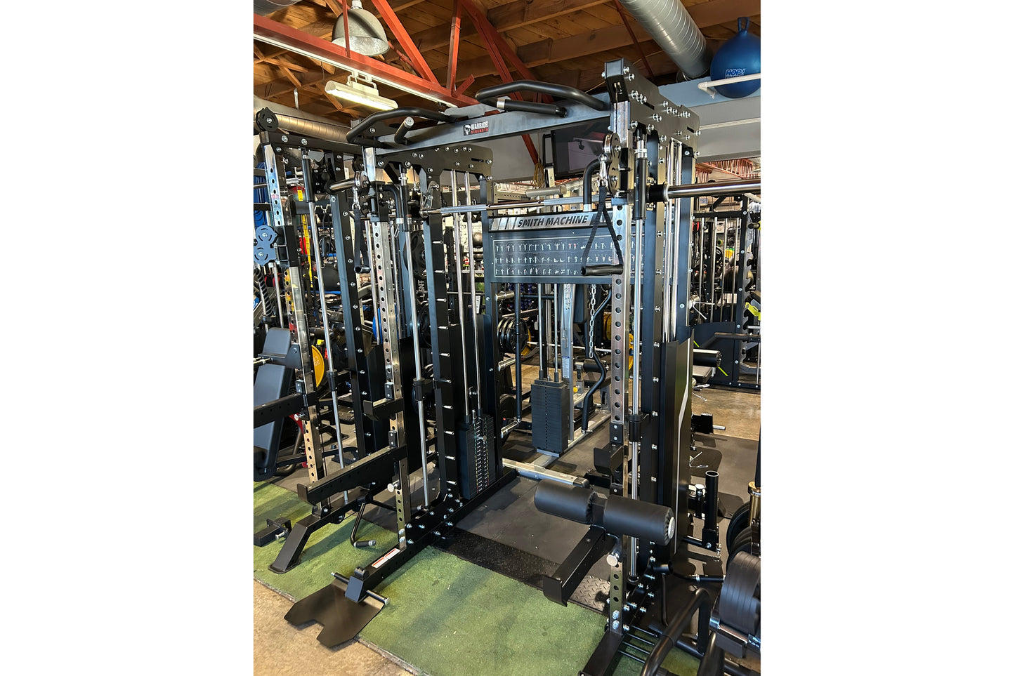 Warrior 901 all-in-one power rack with black steel frame, cable pulleys, smith machine, and adjustable counter-balance system