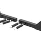 Black steel cable pulley system with four black handles and silver metal pins, flat lay on white background