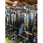 Warrior 901 black all-in-one power rack with integrated cable pulley system, smith machine, and blue padded seat in gym setti