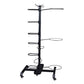 Black metal multi-level accessory storage rack with vertical pole, multiple horizontal arms, and caster wheels on base, shown