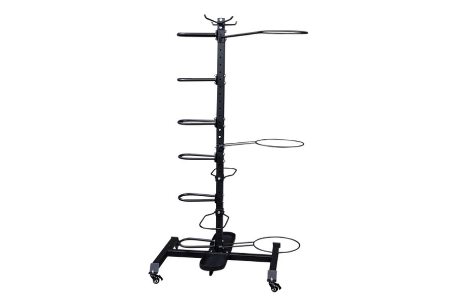 Black metal multi-level accessory storage rack with vertical pole, multiple horizontal arms, and caster wheels on base, shown
