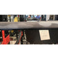 Warrior 6-bearing cerakote barbell bar with camo finish and knurled grip, displayed on gym equipment rack