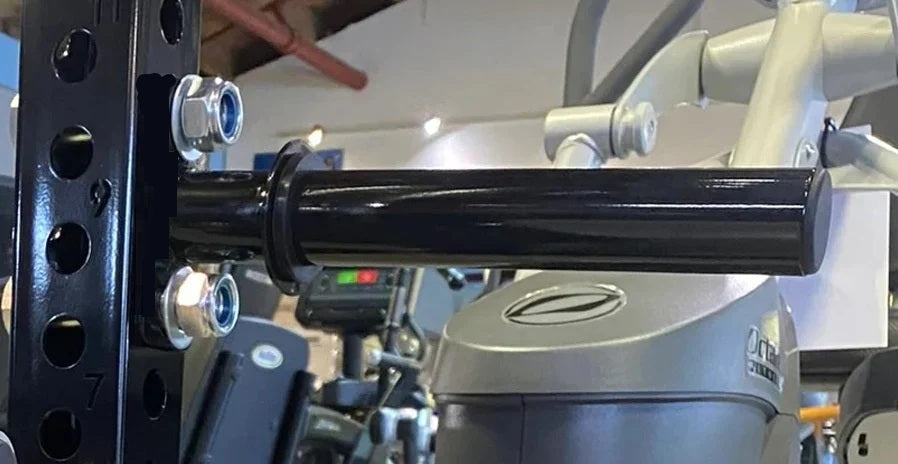 Black steel cable crossover pulley bar attached to gray power rack gym equipment with metal bolts and adjustment mechanisms