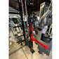 Black and red cable crossover pulley power rack with dual lat pulldown stations in gym showroom setting