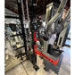 Warrior 3.0 black and red cable crossover pulley power rack with lat pulldown attachment in showroom setting