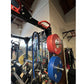 Warrior Cage/Rig Combo with red and blue weight plates, red pull-up bar, and black frame in gym setting