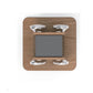 Wooden wall-mounted dumbbell rack with rounded corners, featuring silver metal hooks at four corners and gray center panel, o