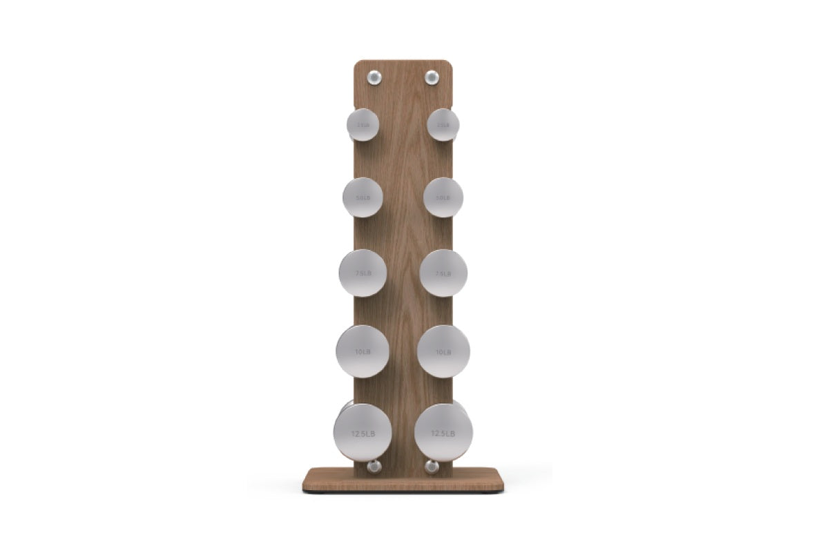 Wooden dumbbell rack with ten pairs of stainless steel dumbbells ranging from 2.5 to 12 pounds, on white background