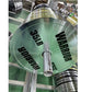 Warrior 25lb chrome Olympic weight plate with black text on green background, displayed on pole in gym setting