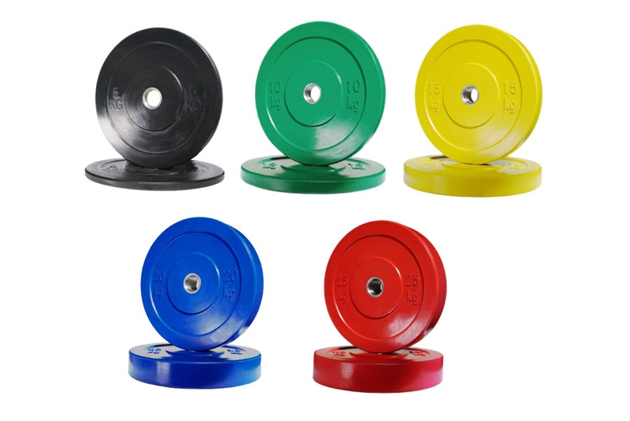 Warrior Olympic color bumper plate set in black, green, yellow, blue, and red with metal centers on white background