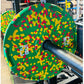 Warrior Fleck green rubber bumper plate with red and yellow speckled pattern on barbell
