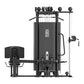 Black multi-station gym equipment with four weight stacks, cable pulleys, leg press platform, and padded seat on white backgr