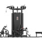Black multi-station gym equipment with five stacked weight stations, pulleys, and leg press attachment on white background