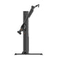 Black commercial dual-arm functional trainer with adjustable arms and orange accent details, shown on white background