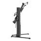 Black dual-arm functional trainer with vertical post, adjustable weight stack, and dual cable arms on white background