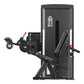 Black commercial leg curl machine with padded seat, footrest, and red accent handles on white background