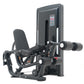 Warrior Pro black leg extension and prone leg curl machine with dual weight stacks and digital display on white background