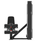 Black commercial leg extension and prone leg curl machine with padded seat, foot platforms, and weight stack on white backgro