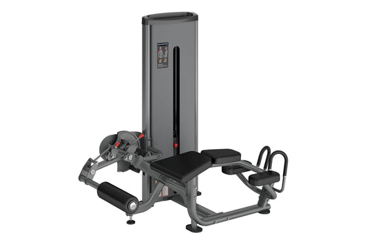 Warrior Deluxe Commercial Series Prone Leg Curl machine with gray steel frame, black padding, and leg extension attachment on