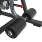 Gray and black upright abdominal crunch machine with padded cylindrical foot platform and red adjustment lever on white backg