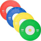 Colorful urethane bumper plates stacked diagonally: red 25kg, blue 20kg, yellow 15kg, and green 10kg with white centers, on w