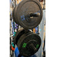 Pair of black speckled bumper weight plates stacked on bar, labeled 45 LB and 25 LB in blue and green text
