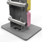 Warrior D22.5 adjustable dumbbells with yellow and pink weight plates, chrome handles, and gray base stand