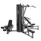 Black and gray multi-station gym with leg press, chest press, and lat pulldown stations on white background