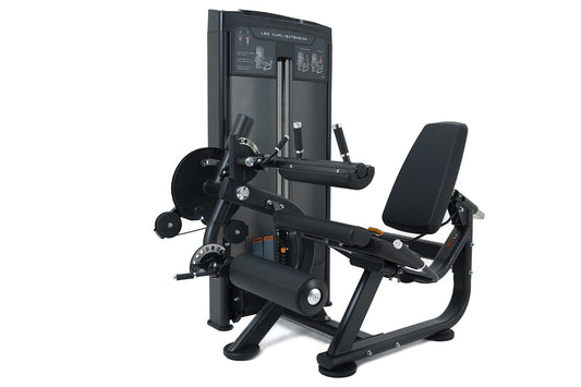 Black commercial leg curl and extension machine with padded seat, weight stack, and instruction panel on white background