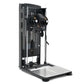Black and gray commercial standing flight trainer with dual control wheels, digital display, and metal footplate on white bac