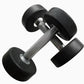Pair of black urethane dumbbells with textured gray handles, isolated on white background