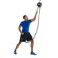Man wearing blue t-shirt and black shorts using black rope pulley trainer system on white background