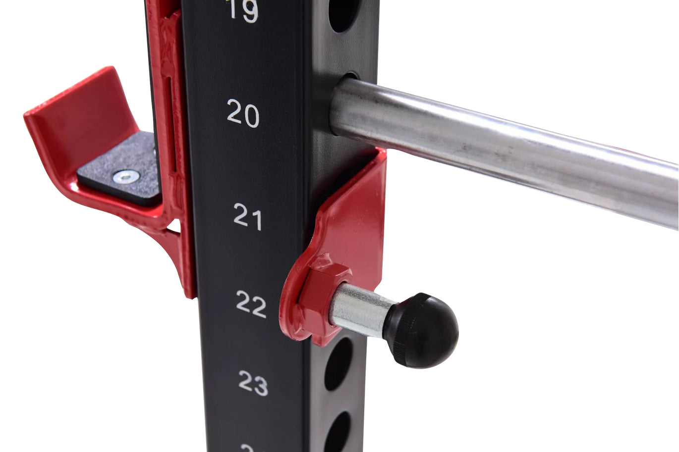 Red and black cable pulley power rack with numbered height markers, chrome bar, and adjustable seat pad, shown on white backg