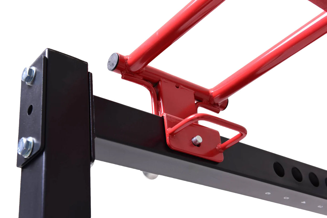 Red and black steel power rack with cable pulley system, featuring adjustable mounting brackets and metal hardware on white b