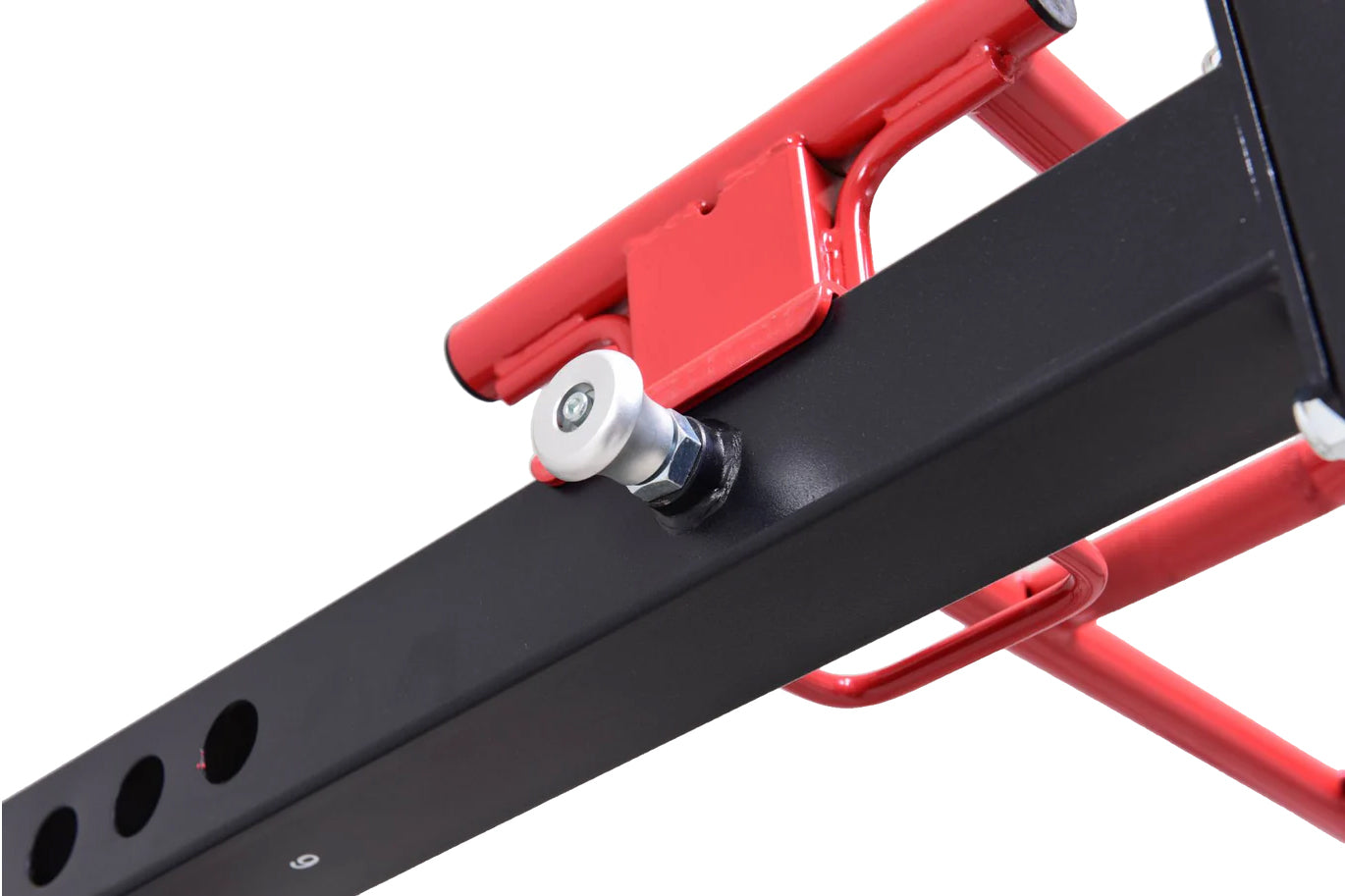 Red and black metal freestanding power rack with cable pulley system and adjustable wheels, shown on white background