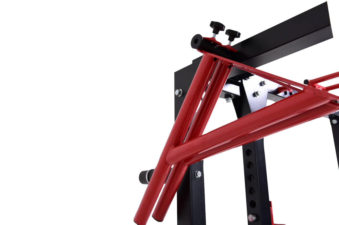 Red and black metal cable pulley power rack with foldable frame, adjustment knobs, and weight plate pegs on white background